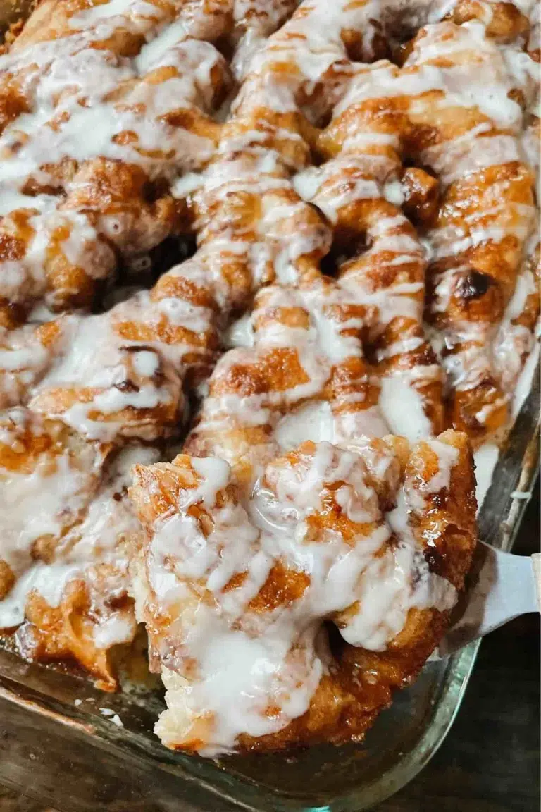 Baked sourdough cinnamon roll focaccia drizzled with icing