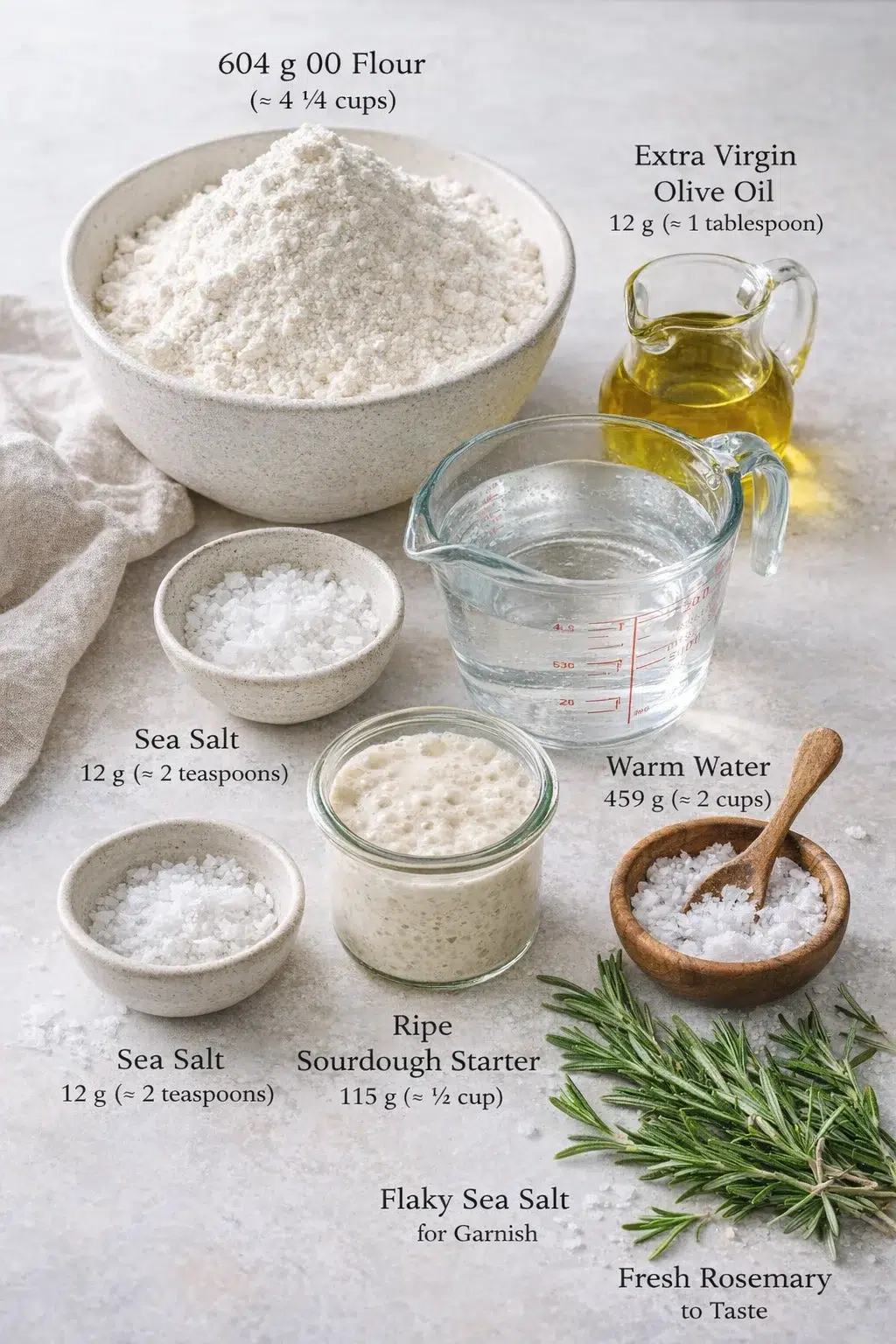 Measured ingredients arranged for Soft & Crispy Sourdough Focaccia Bread (Beginner Friendly) - Munchkin Time: 604 g 00 Flour, about 4 ¾ cups, scoop and level (If needed: 423 g all-purpose flour (≈ 3 ⅓ cups) plus 181 g br