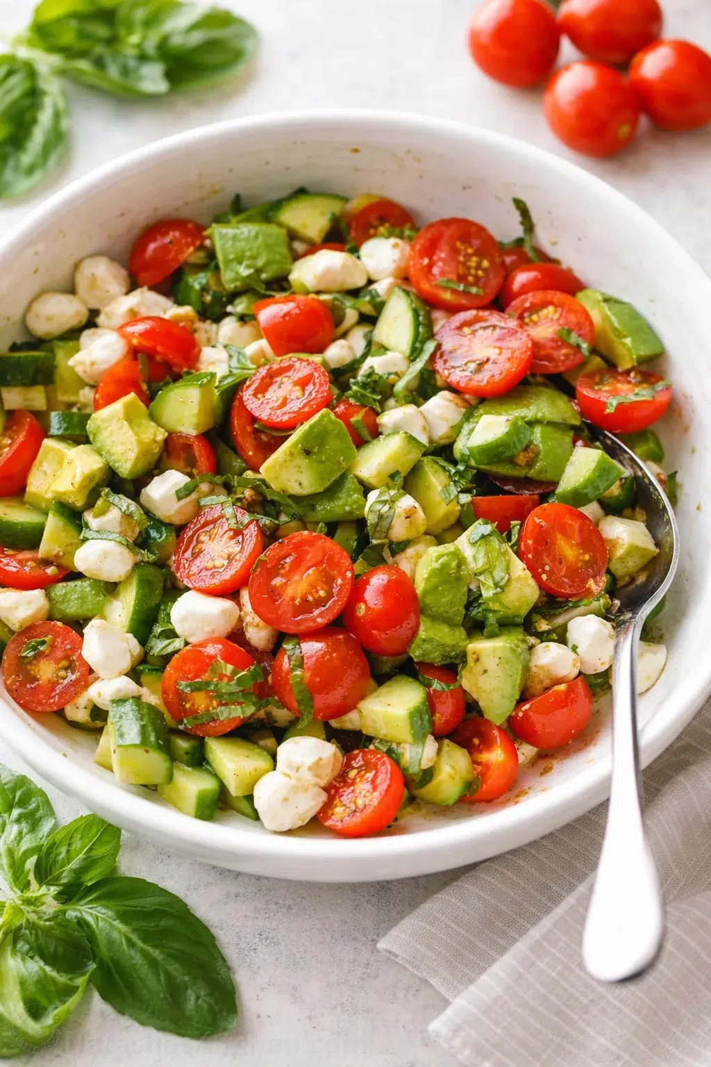 Final plated Tomato Cucumber Mozzarella Salad served as a hero shot