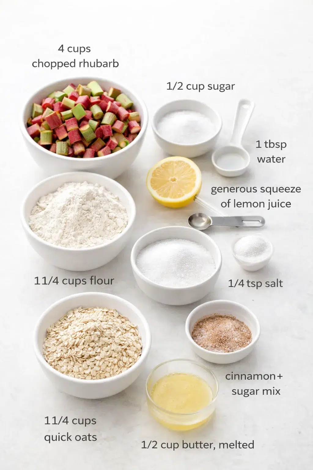 ingredients-placeholder.png Measured ingredients arranged for Rhubarb Oat Bars: 4 cups chopped rhubarb, 1/2 cup sugar, 1 tbsp water, generous squeeze of lemon juice, 1 1/4 cups flour, 1 1/4 cups quick oats