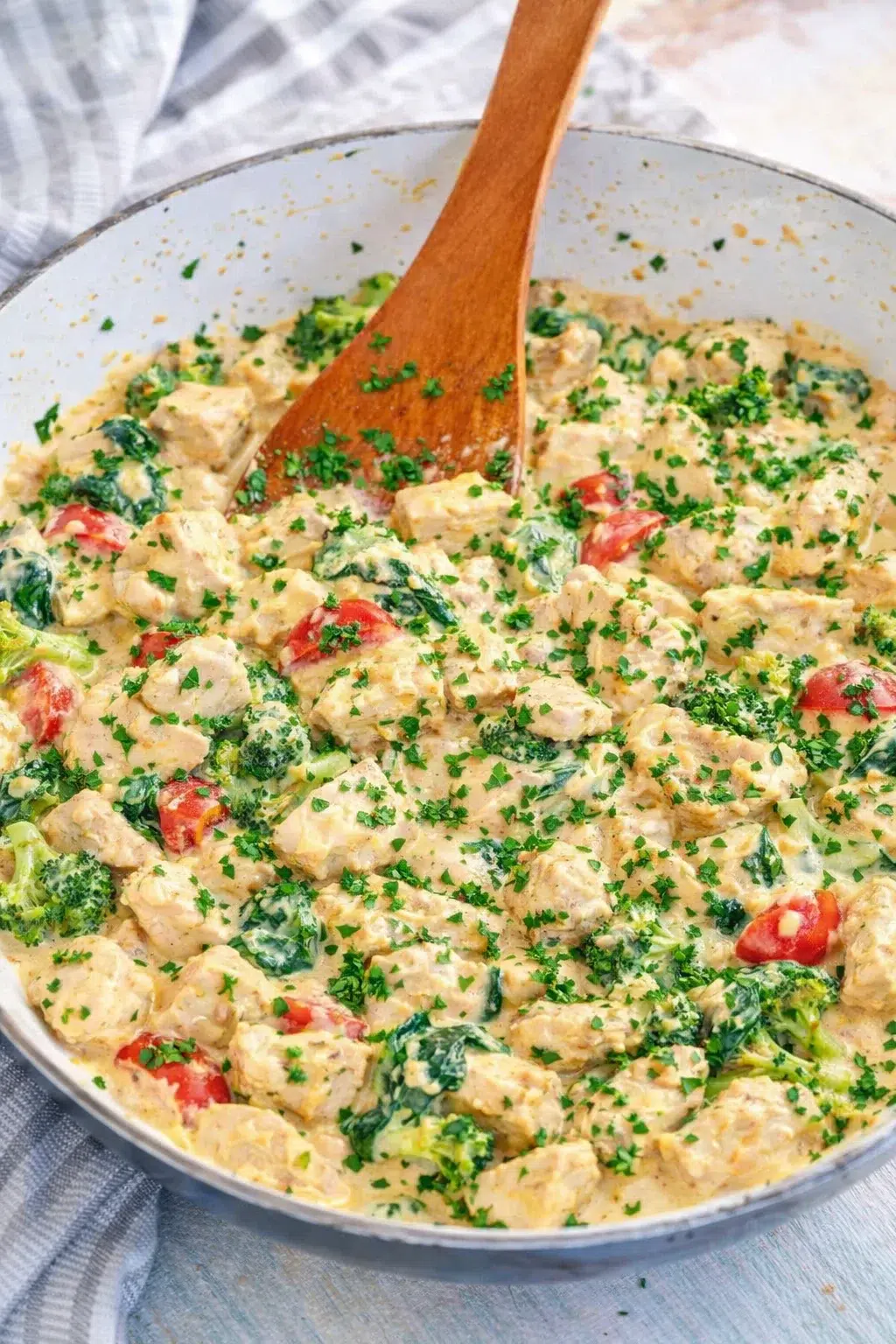 step-process-placeholder-9-10.png Sauce being stirred until cheeses melt and mixture turns creamy, skillet finished with chopped parsley sprinkled.
