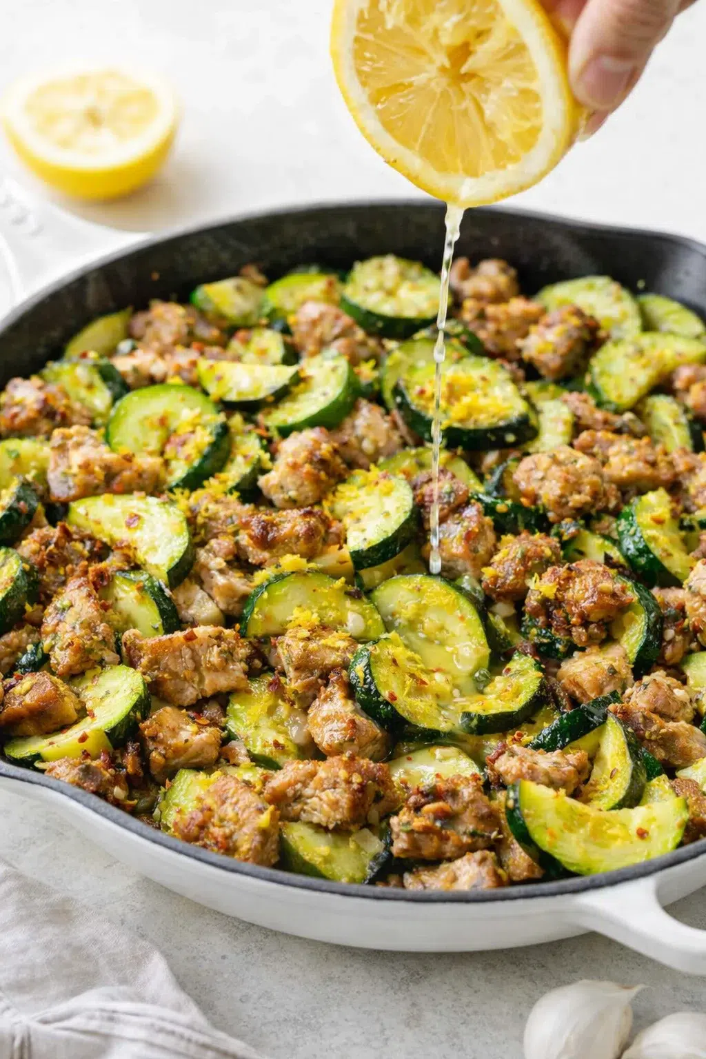 step-process-placeholder-13-14.png Chicken tossed with lemon zest and juice in skillet, steaming as it's pulled off heat.