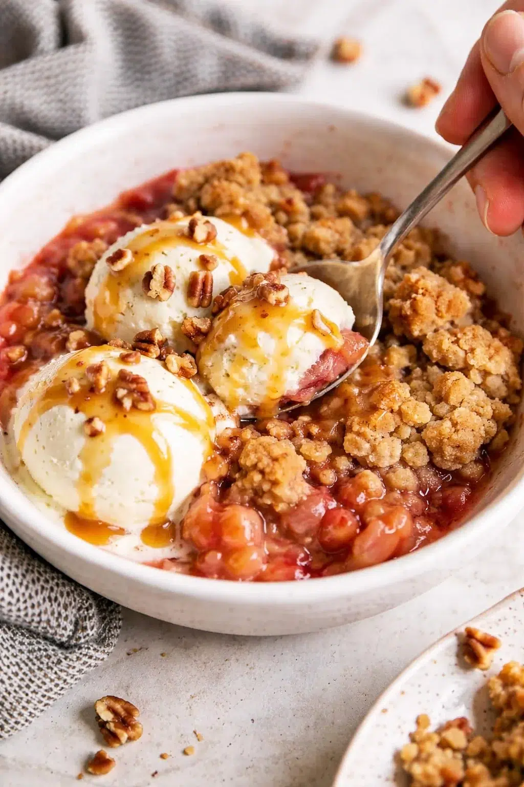 Single plated variation of Easy Rhubarb Crisp Recipe [+ Video] - Savory Nothings shown in a natural kitchen scene