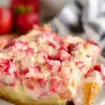 Strawberry Rhubarb Custard Dessert slice with bite on fork