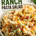 Creamy Bacon Ranch Pasta Salad with crispy bacon, cheddar cheese, ranch dressing, and rotini pasta served in a bowl